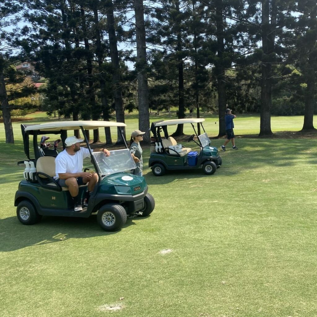 man riding golf cart